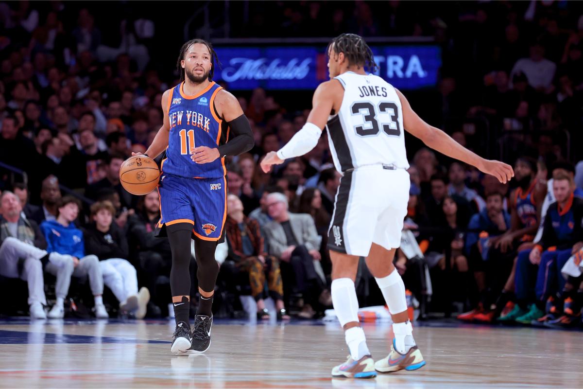 Nov 8, 2023; New York, New York, USA; New York Knicks guard Jalen Brunson (11) brings the ball up court against San Antonio Spurs guard Tre Jones (33) during the third quarter at Madison Square Garden.
